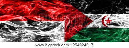 Indonesia Vs Sahrawi Smoke Flags Placed Side By Side. Thick Colored Silky Smoke Flags Of Indonesian 