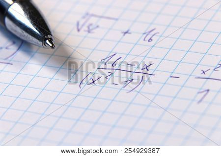 A Some Math Example On Math Lesson Or Example For Homeworks. Also We Can See Blue Pen. Schoolwork Fo