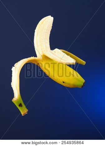 Banana - Platano
Bananas Suspended In The Air. Blue Gradient Background.