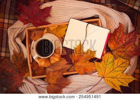 Coffee, Crossants, Opened Notebook, Gray Scarf And Autumn Maple Leaves On Warm Brown Plaid. Autumn F