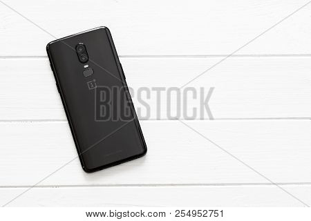 Khakiv, Ukraine - 14 August 2018: Modern Smartphone OnePlus 6 on the white wooden table