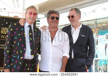 LOS ANGELES - AUG 22:  Simon Cowell, brothers at the Simon Cowell Star Ceremony on the Hollywood Walk of Fame on August 22, 2018 in Los Angeles, CA