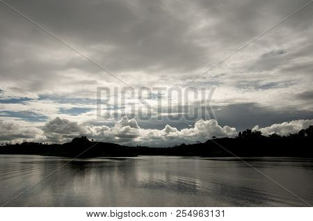 Stormy Sky Over The Water With Some Reflections