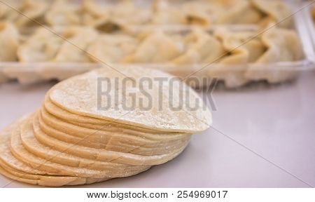 Stack Of Raw Chinese Dumpling Skins With Flour
