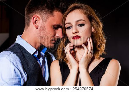 Loving Husband Helping Wife Overcome Problems On The Black Background