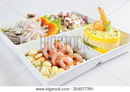 Peruvian Cuisine, Cebiche, Causa Rellena And Tiradito Of Fish. On A White Background.