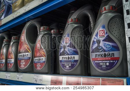 Omsk, Russia - August 22, 2018: Shop Window With Goods, Cans Of Motor Oil Of Different Manufacturers