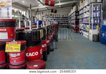 Omsk, Russia - August 22, 2018: Shop Window With Goods, Cans Of Motor Oil Of Different Manufacturers