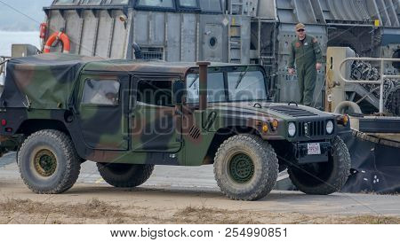 Chonburi, Thailand - February 17, 2018: Us Marine Humvee Drive Pass Landing Craft Air Cushion Or Lca