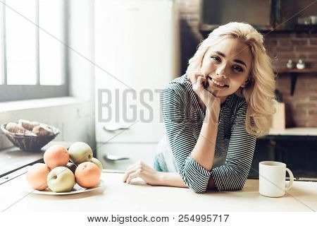 Young Smiling Woman Next To Bowl Of Fresh Fruits. Portrait Of Young Beautiful Girl Next To Bowl Fill