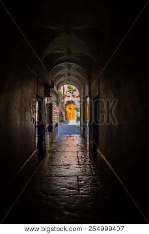 A Passageway (traboule) In The Center Of Lyon Ends In A Old Door.