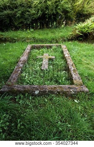 Balquhidder, Scotland  - September 17 2019: Close Up Fo A Grave With A  Cross In The Local Cemetery,