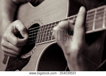 Musicians Are Playing Acoustic Guitar.