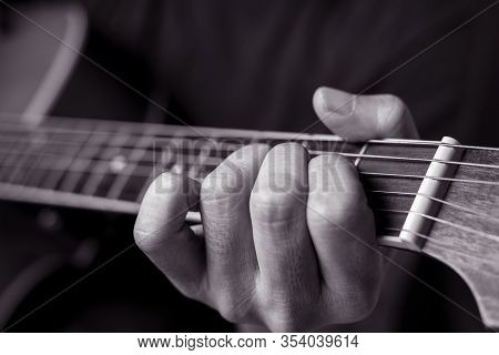 Musicians Are Playing Acoustic Guitar.