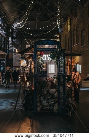 London, Uk - December 14, 2019: Flower Decorated Phonebooth Sponsored By Daniel Wellington Inside Sp