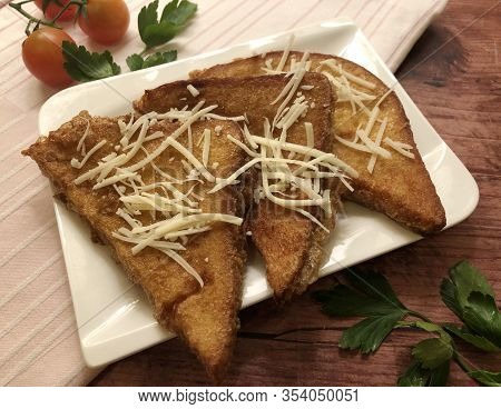 Crispy, Golden Savory French Toast With Cheese And Tomatoes. Sliced Bread Coated In Beaten Eggs And 