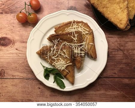 Crispy, golden savory french toast with cheese and tomatoes. Sliced bread coated in beaten eggs and 