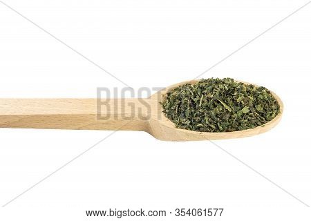 Dried Nettle Herb Or In Latin Utricae Folium In Wooden Spoon Isolated On White Background. Medicinal