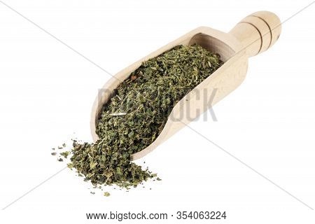 Dried Nettle Herb Or In Latin Utricae Folium In Wooden Scoop Isolated On White Background. Medicinal
