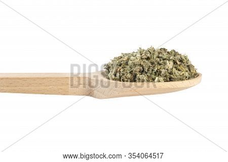 Dried Artichoke Leaves Or In Latin Cynarae Folium In Wooden Spoon Isolated On White Background. Medi