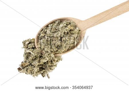 Dried Artichoke Leaves Or In Latin Cynarae Folium In Wooden Spoon Isolated On White Background. Medi