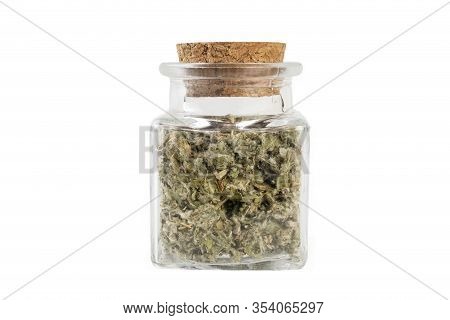 Dried Artichoke Leaves Or In Latin Cynarae Folium In A Glass Jar Isolated On White Background. Medic