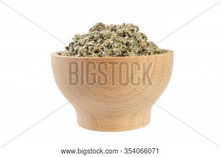 Dried Artichoke Leaves Or In Latin Cynarae Folium In Wooden Bowl Isolated On White Background. Medic
