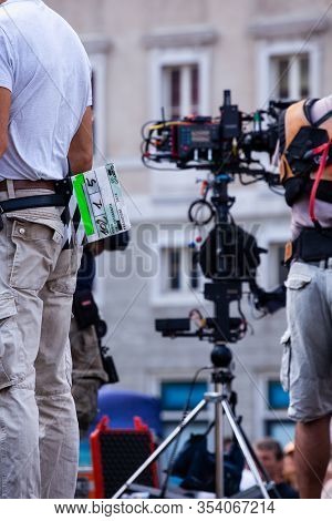 Behind The Scene. Film Crew Team Filming Movie Scene On Outdoor Location