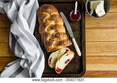 Traditional Sweet Easter Bread With Raisins, Dried Cherries On An Old Baking Tray Jam And Butter. Co