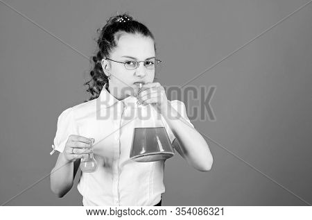 Child Study Bilogy Lesson. Small Smart Girl With Testing Flask. Education And Knowledge. Science Res