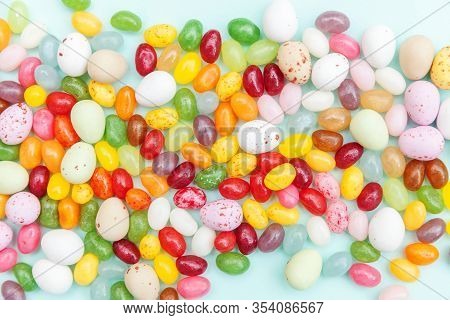 Happy Easter Concept. Preparation For Holiday. Easter Candy Chocolate Eggs And Jellybean Sweets Isol
