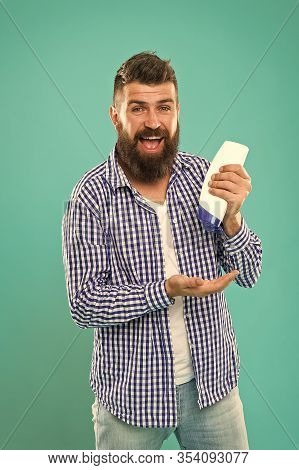 Man Hold Shampoo Bottle. Hair Care. Shampoo For Daily Use. Skin Lotion. Shampoo And Conditioner You 