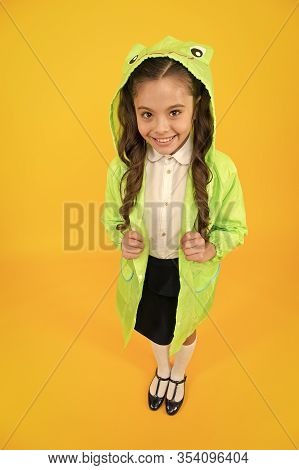 Frog Style. Schoolgirl Hooded Raincoat Enjoy Fall Weather. Rainproof Accessories Make Rainy Fall Day