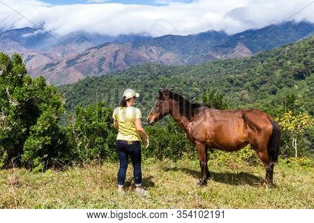 Local Costa Rican Woman With Her Horse High In The Mountains Of Costa Rica