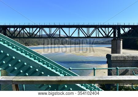 Beach With Forest And Two Train Bridges Over Sor Coastal River. O Barqueiro, A Coruña Province, Gali