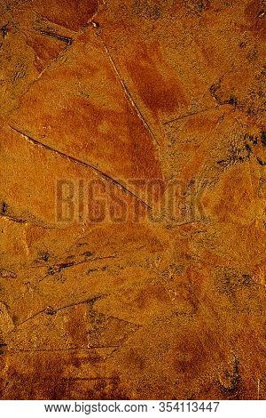 closeup of a golden textured plastered surface to be used as a background