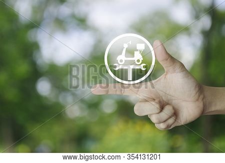 Hand Pressing Service Fix Motorcycle With Wrench Tool Flat Icon Over Blur Green Tree In Park, Busine