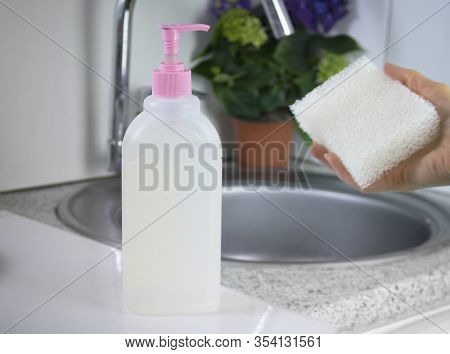 The Cleaning Transparent Gel-like Product For Washing Hands And Dishes In Focus. Biodegradable Plast