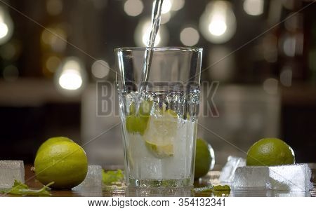 Fizzy Water Pouring Into A Glass
