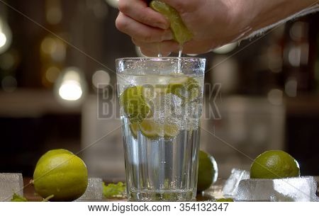 Male Hand Squeezing Lime