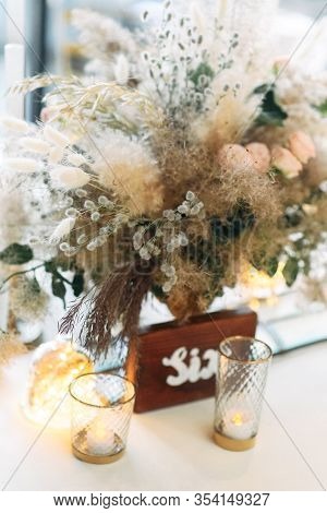 Boho Style Festive Table Decor In Warm Colors. Bouquet With Fluffy Pikelets, Pampas Grass And Dried 