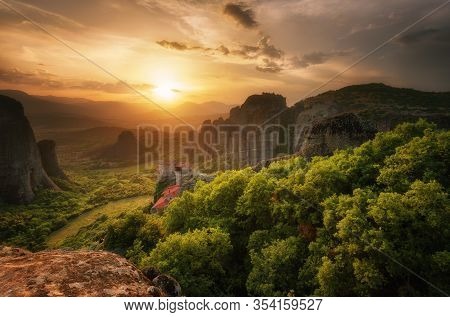Monastery Meteora Greece. Stunning Spring Panoramic Landscape At Sunset. View At Mountains And Green