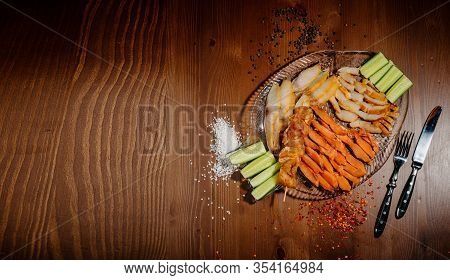 Fish Appetizer Of Dried Fish Pieces On A Plate