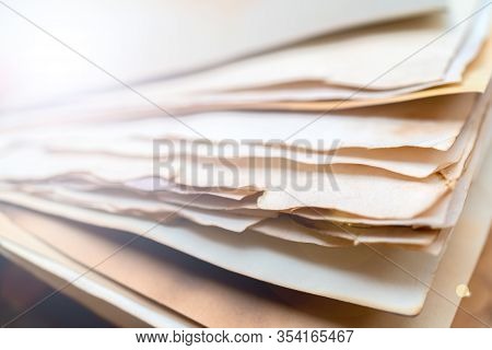 Stack Of Vintage Paper. Old Yellow Sheets Of Paper. Yellow Pages Of The Book.