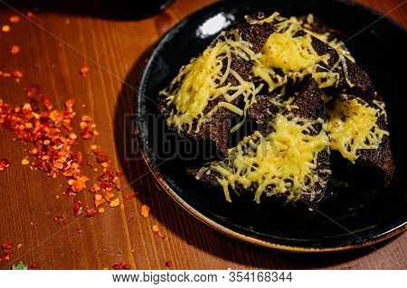 Rusks With Cheese, Leek, Sauce On A Wooden Old Table