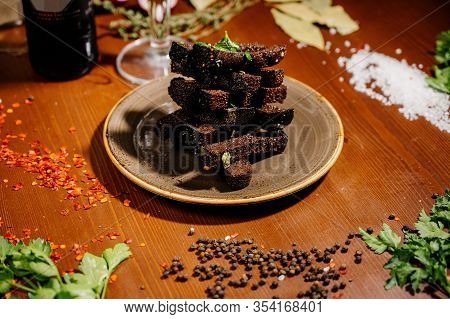 Rusks With Leek, Sauce On A Wooden Old Table