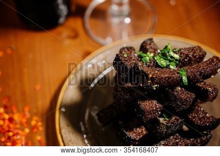 Rusks With Leek, Sauce On A Wooden Old Table
