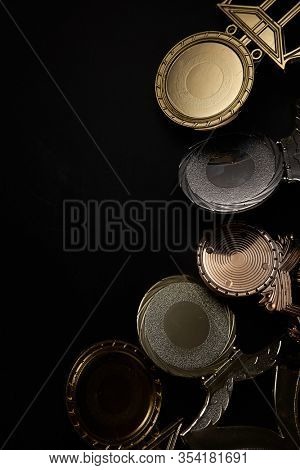 Golden trophy over blackboard background. top view. flat lay.Trophy is a specific achievement, serves as recognition / evidence of merit, awarded for sporting events