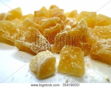 Succade From Ginger On White. Food And Ingredients Background.