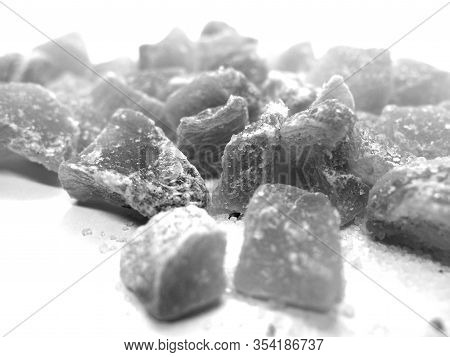 Succade From Ginger On White In Black And White. Food And Ingredients Background.